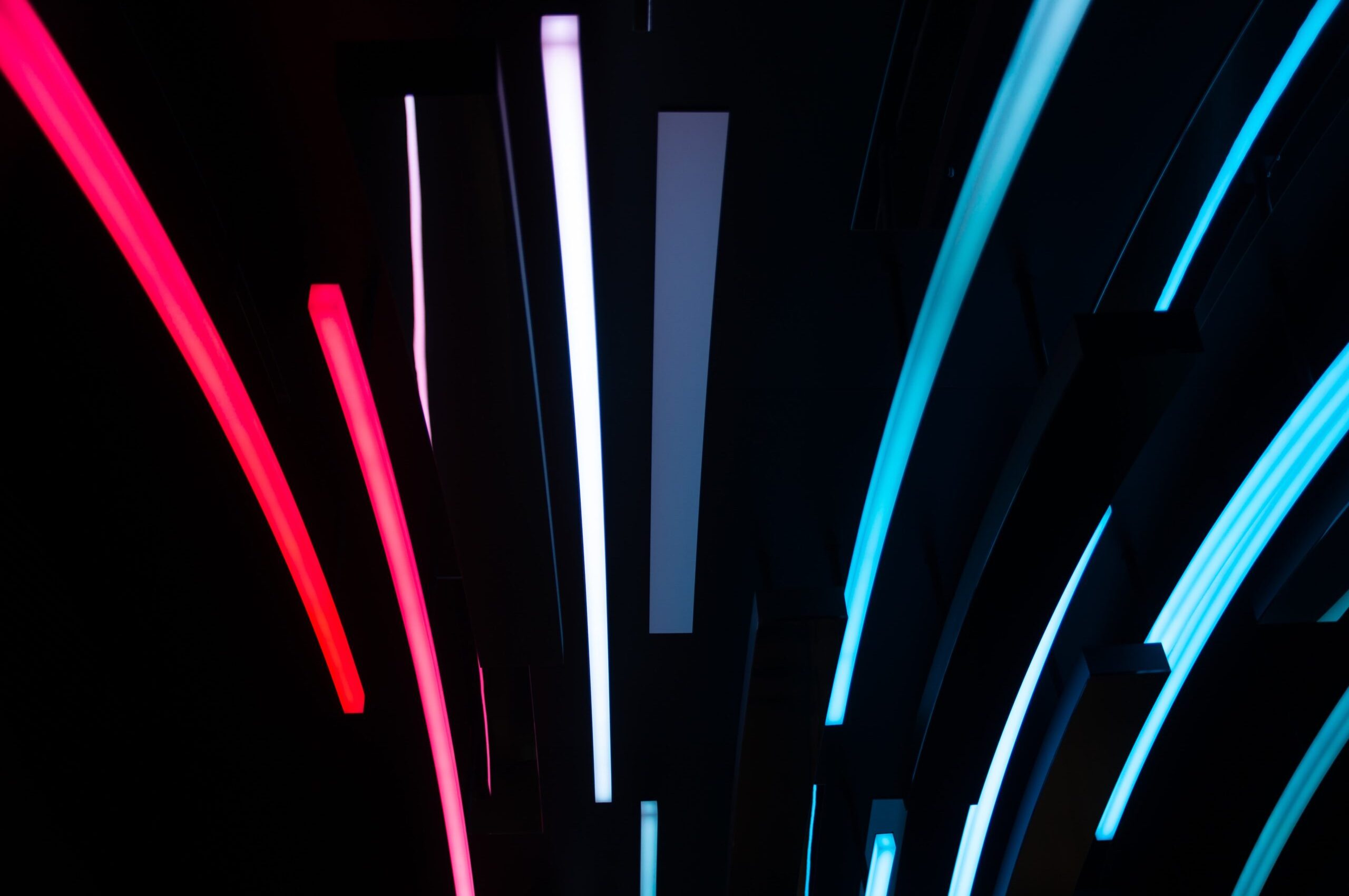 Abstract construction industry innovation concept with red, white, and blue neon lights.