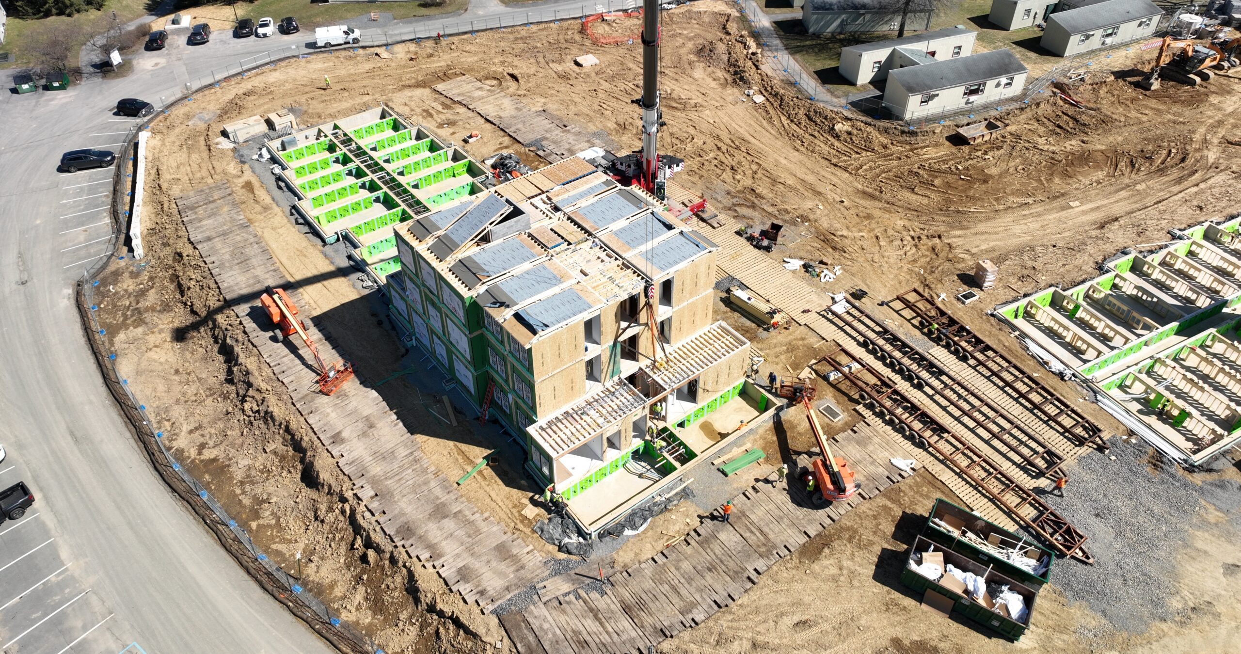 Bucknell University modular construction project: Aerial view of building construction with crane and modules.