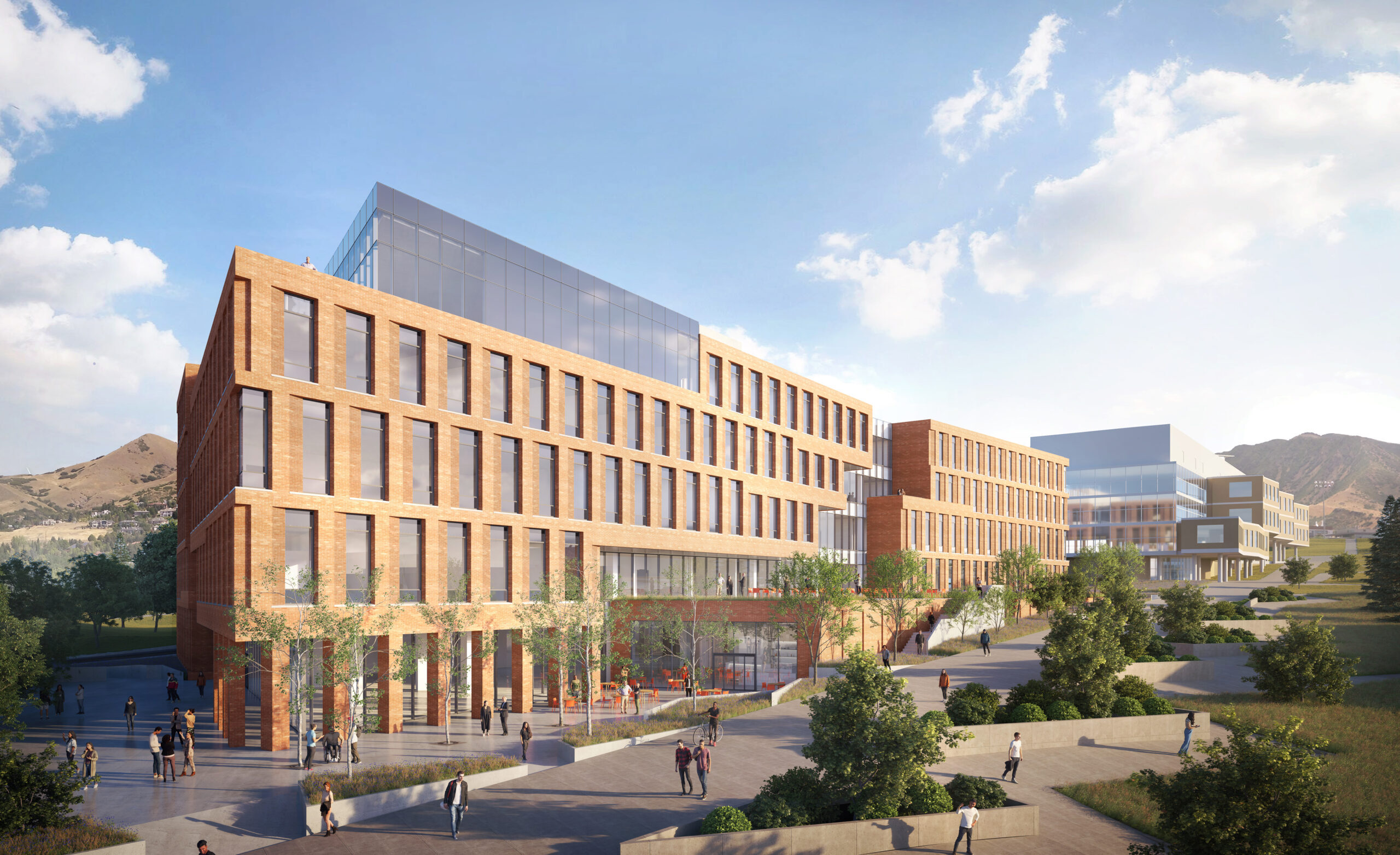 University of Utah building with brick facade and modern glass addition.