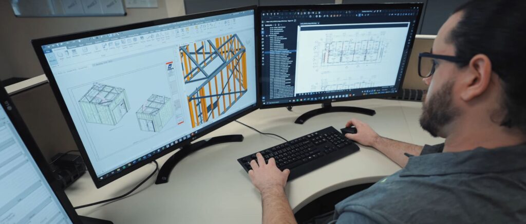 Architect using Revit software for healthcare clinic design.