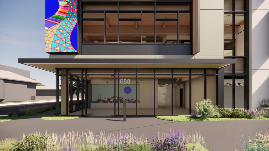 UCSF's mass timber project entrance with colorful art. "688" is visible above the door.